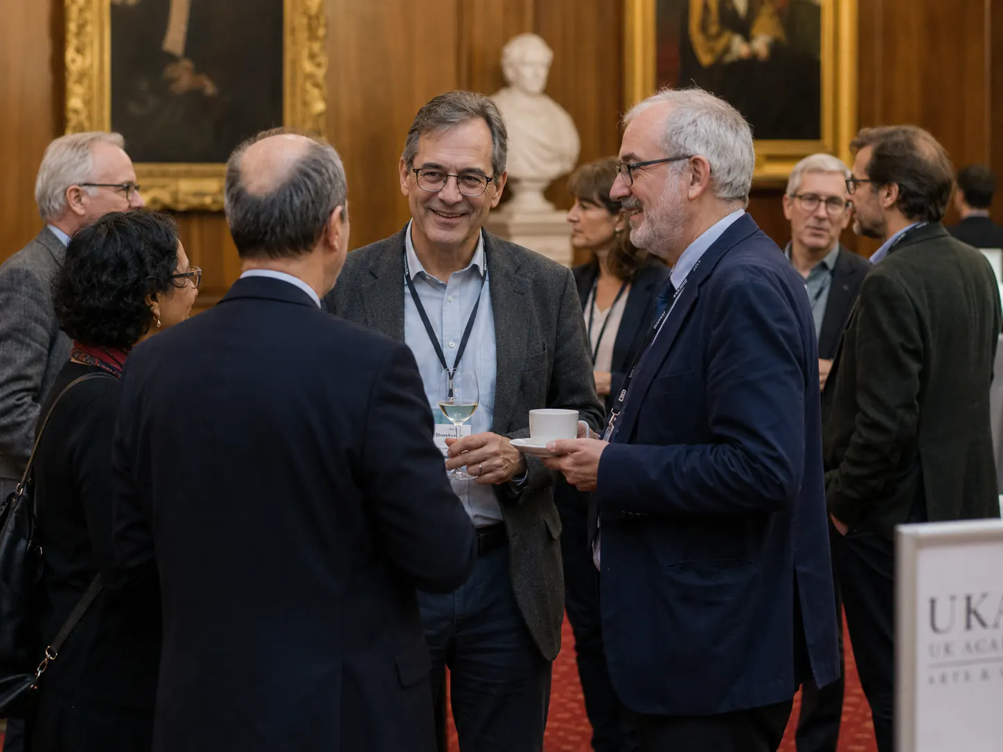 Academics and professionals in conversation at an Academy reception